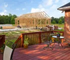 Detached ADU builders in Dallas TX constructing a backyard accessory dwelling unit near an existing home